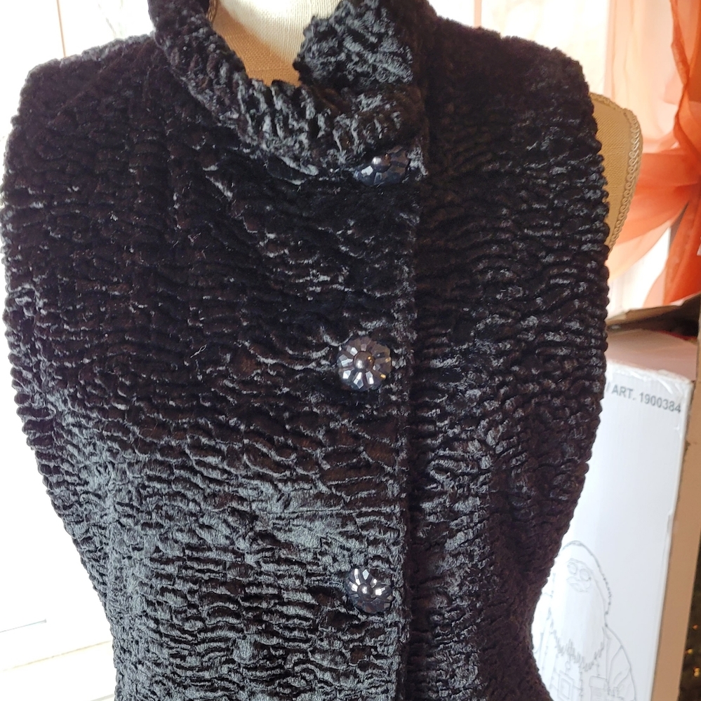 Faux fur vest pretty buttons.